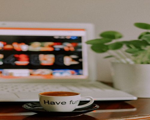 Short break during a regular workday, coffee on a desk